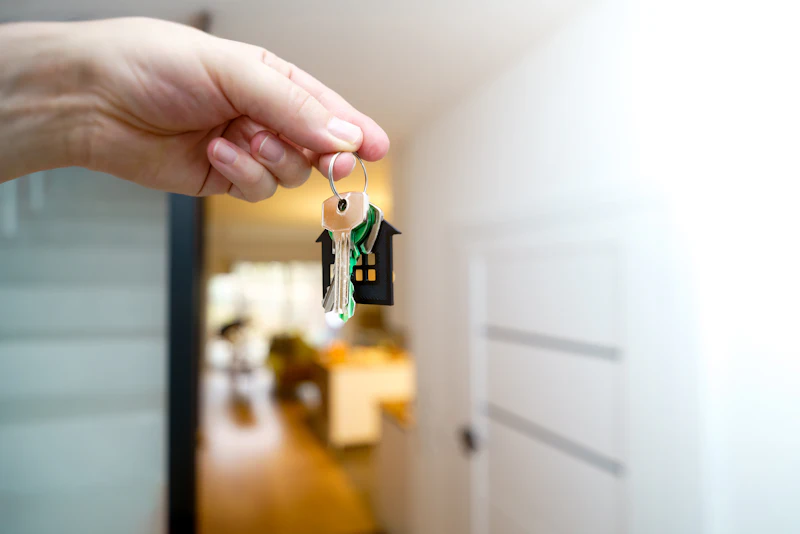 Holding the keys to a new home at the front door